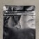Eight -shirt package with a valve, flat bottom, black, 15 x 32.5 x 9.5 cm