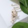 Brooch "Cat" grace, matte white color in gold