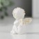 Souvenir Polystone "Angel with handles on the knees sits" White with gold 4x3x2 cm