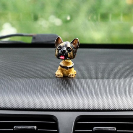 Dog on a car panel shocking his head, German shepherd-2