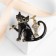 Brooch "Cat" with a fish, black color in gold