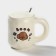 Ceramic mug with a spoon "Bear", 450 ml, beige color