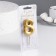 A candle for a cake on a “line” skewer, 5.5 cm, number “8”, gold