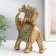 Polystone souvenir "Elephant with an elephant on the back - exotic flowers" 16x6.5x20.5 cm