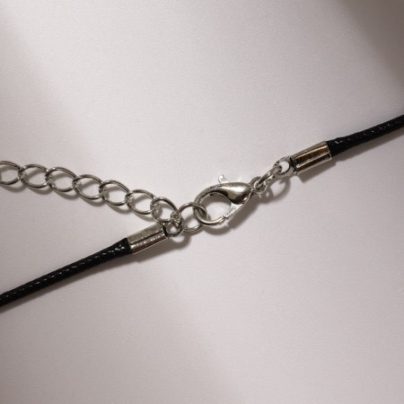 Piece on the cord "handcuffs", color black silver on a black lace, 42 cm-2