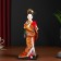 Collectible doll "Geisha in an orange kimono with a fan" 22.5 cm