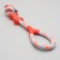A training cable toy with a bone, up to 120 g, up to 40 cm, mix of flowers