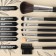 A set of makeup brushes "monogram", 7 objects, a cover on a button, golden color/black