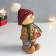 Polystone souvenir "Baby in a red hat and a green scarf with a gift" 7.5x10x17 cm