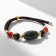Buslet “Busina Ji” on the lace, oval, colored, d = 7 cm