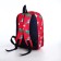 A backpack with a zipper, external pocket, red color
