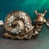 Pig a case "Snail with flowers" 42x22x30cm, bronze with silver