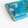 Women's wallet on the button, green color