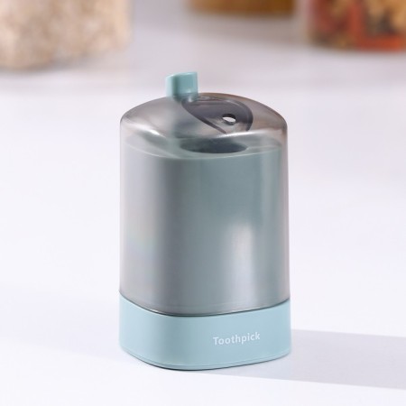 The dispenser for toothpicks is automatic, the color is green