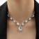 Set 2 objects: earrings, necklace necklace drops, one thread, white color in silver, 35 cm