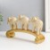 Polystone souvenir "Three white elephants on an arc, with gold - layers" 26x5.5x13 cm