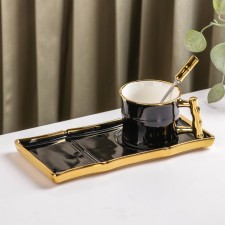 Tea couple ceramic with a spoon 