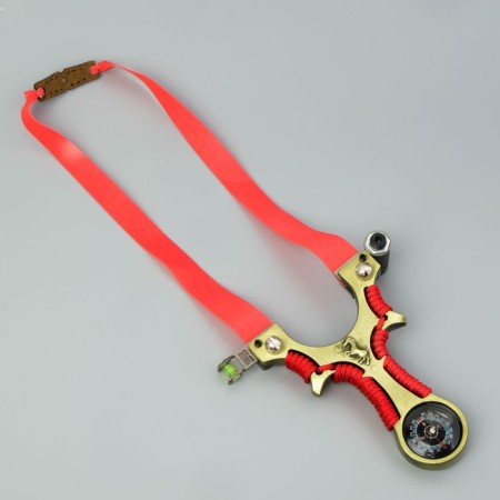 Metal slingshot with a laser target designator, compass