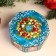 The box is octagonal, blue, mix, 15.3x15.3x6.7 cm