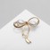 Brooch "Bow" with pearls, white color in gold
