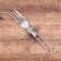 A set of folding devices "when it pecks", fork, spoon, knife