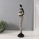 Polystone souvenir "African in a dress with leaves, with a pot" White with black 8.5x8x39 cm