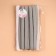 The elastic band is becoming, with an openwork edge, 10 mm, 10 ± 0.5 m, the color is gray