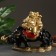 Figure "Hotty on the buffalo" red gold 46x22x38.5cm