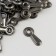 Photo-chanker metal (set 100 pcs) black curly 2x0.9 cm
