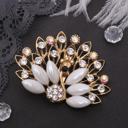 Brooch "Peacock" with a fluffy tail, white-radiant color in gold-1