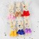 Soft toy "Bunny skirt with a bow" on a key fob, color mix