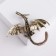 Brooch "Dragon" flying, plum color in black gold