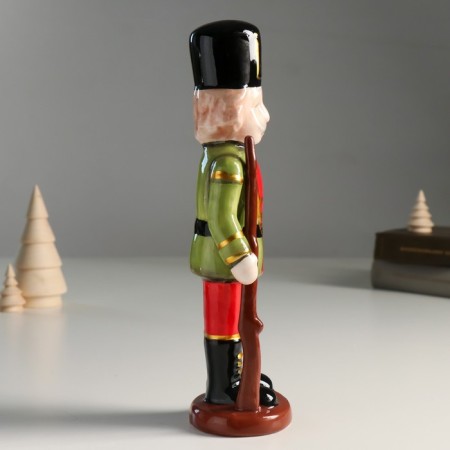 Souvenir Ceramics "A mustachioed Nutcracker in a green-red camisole with a gun" 25x8x6.5 cm-1