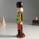 Souvenir Ceramics "A mustachioed Nutcracker in a green-red camisole with a gun" 25x8x6.5 cm