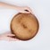 A plate of natural cedar magistro, d = 23 cm, brown color