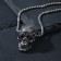 Pendant "Skull" with a pattern, color black silver, 70 cm