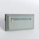 Women's wallet on the button, green color