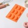 The form for baking the share "Easter. Chocolate egg ”, silicone, 9 cells, 28 × 16 × 2 cm, orange color