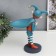 Souvenir Polystone Standing "Baby-Skomorokh with a bag" Orange-blue 33x12.5x25.5 cm
