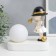 Souvenir Polystone Light "Baby in a black hat, with a gold bubble at the ball" 16.5x8x16 cm