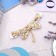 Brooch "Dragonfly", faceted wings, blue color in gold