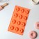 The form for baking the share "German cupcake. Openwork ", silicone, 12 cells, 28 × 16 × 1.5 cm, orange color
