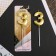 Candle for the cake, the number "3", gold.