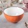 Porcelain bowl Wilmax Splash, 600 ml, d = 13 cm, orange color