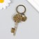Metal keychain, glass "Castle-heart and key with the owl" bronze 10 cm