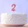 Candle for the cake, the number "2", pink.