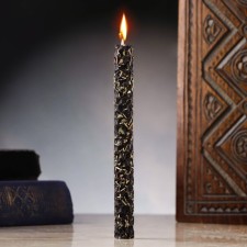 A candle from wax with thyme 