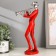 Polystone souvenir "Musician with saxophone" Red with silver 29.5x10.5x13.5 cm