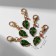Charm "leaf", green color in gold