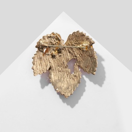 Brooch "Leaf" with curls, the color of yellow-orange in gold-1